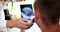 Doctor otorhinolaryngologist examining patient ear using modern digital otoscope closeup 4k movie slow motion