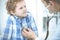 Doctor and patient child. Physician examining little boy. Regular medical visit in clinic. Medicine and health care