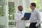 Doctor and patient smiling and discussing medical record in the hospital