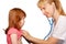 Doctor pediatrician listening to the child\'s heart