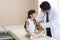 Doctor is a physical exam for the child girl