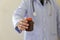 doctor, physician holding drug in hand at workplace. anacea, life save service, prescribe medicine, legal drug store, disease