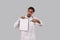 Doctor Pointing at Clipboard Isolated. Indian Man Doctor Blank Clipboard in Hands