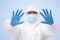 Doctor in PPEh suit protective and Surgical mask  Raising hands with glove on white background