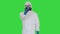 Doctor in protective suit checking your temperature on a Green Screen, Chroma Key.