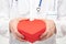 Doctor with red gift box heart shaped