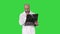 Doctor reviewing shoulder x-ray scan while walking on a Green Screen, Chroma Key.