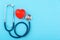 Doctor`s Day concept, flat lay top view, stethoscope with red hearts diagnosis of heart disease