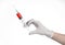 Doctor\'s hand holding a syringe, white gloved hand, a large syringe, the doctor makes an injection, white background