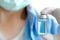 Doctor`s hand, he holds a bottle of antiretroviral drugs, blue water. Health and medical concepts