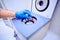 doctor`s hand holds an empty capsule over a medical centrifuge in the dentistry office