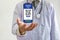 Doctor`s hand, international mobile phone icon, covid vaccine passport, QR scan Code for traveling abroad