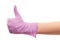 Doctor\'s hand in purple surgical glove showing thumbs up sign