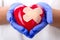 Doctor\'s hands holding plastered heart