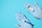 Doctor\\\'s hands in medical gloves holding a vial of vaccine and syringe, top view. Global population vaccination concept