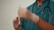 Doctor\'s hands in white gloves hold syringe ready for injection