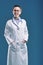 Doctor\'s professional presence against blue backdrop