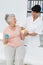 Doctor with senior patient using stress buster balls