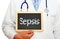 Doctor with sepsis chalkboard