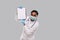 Doctor Showing Clipboard Wearing Medical Mask and Gloves Isolated. Indian Man Doctor Blank Clipboard in Hands