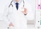 Doctor showing his business card, Medical concept, medical insurance, man in white uniform. Copy space