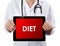 Doctor showing tablet with DIET text