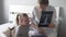 The doctor shows the little girl an X-ray of her lungs