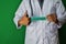 A doctor standing, Hold the Veterans Health paper text on Green background.