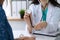 Doctor with a stethoscope in the hand. Physician is ready to examine her female patient.