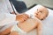 Doctor with stethoscope listening to baby patient