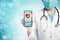 Doctor with stethoscope and smart phone in hand for medical exam concepts