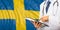 Doctor on Sweden flag background. 3d illustration