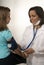 Doctor Takes Girl\'s Blood Pressure. Vertical