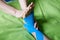 Doctor taping woman injury leg.