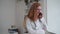 Doctor telemedicine service woman in glasses talks on phone 