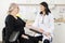 Doctor Touching Senior Patient\'s Arm Before Blood Test