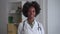 Doctor trainee at hospital African-American woman smiles