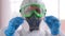 Doctor virologist scientist wearing in mask PPE suit with vaccine