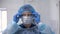 Doctor wearing glasses, surgical mask and gloves,