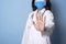 Doctor wearing mask covering mouth and nose and gesture hand stop epidemic corona virus protection