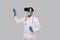 Doctor Wearing VR Glasses, Medical Mask and Gloves Tapping Isolated. Indian Man Doctor Pointing in Virtual Reality