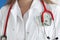 Doctor in white coat has cash in his breast pocket