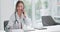 Doctor, woman and phone call with telehealth consultation with smile for healthcare and medical work in clinic