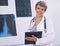 Doctor, woman and portrait with clipboard, radiology for surgery with anatomy scan and healthcare. Senior medical