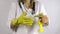 Doctor woman put stethoscope and yellow rubber gloves on hands