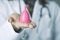 Doctor woman showing a pink menstrual cup