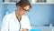 Doctor woman in a white coat and glasses with a folder in her hands. Professional nurse, medicine and healthcare