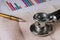 Doctor workplace stethoscope on cardiogram sheet closeup