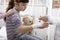 Doctor wrapping a bandage on a girl`s wrist