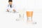 Doctor writes the medical prescription on a desk office with glass and aspirin tablets, cold and flu cure concept, web banner